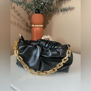Black and gold hand bag- brand new